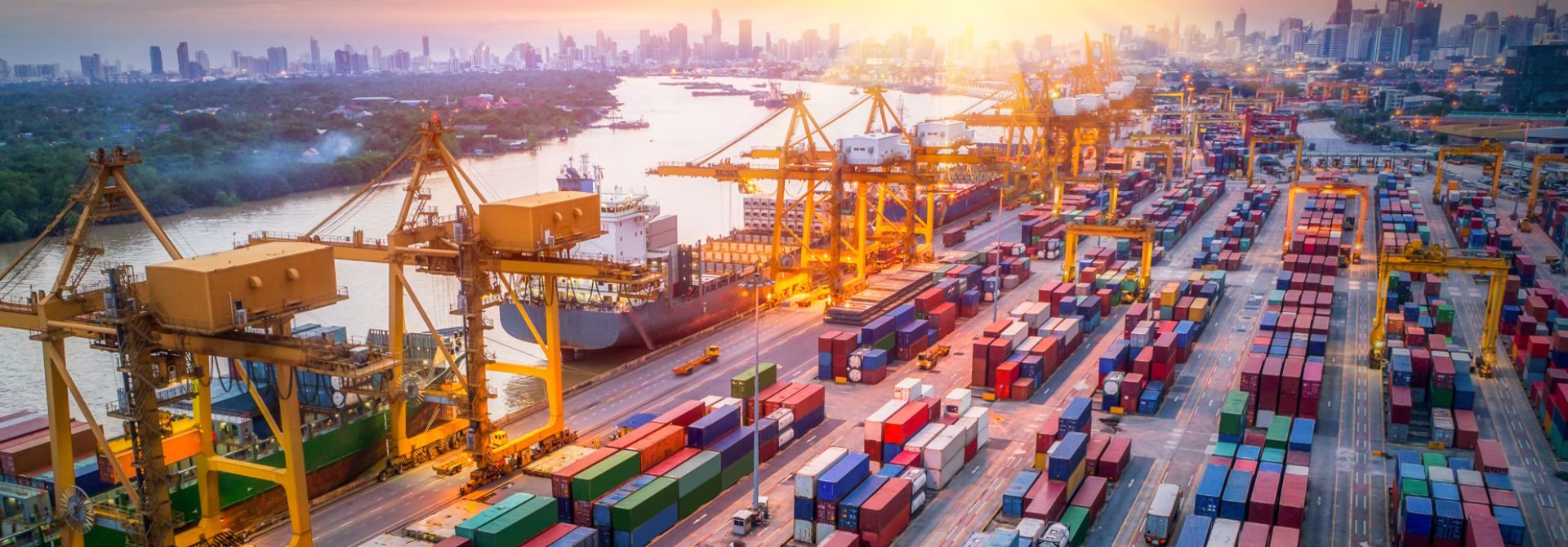 container ships at dock at sunrise