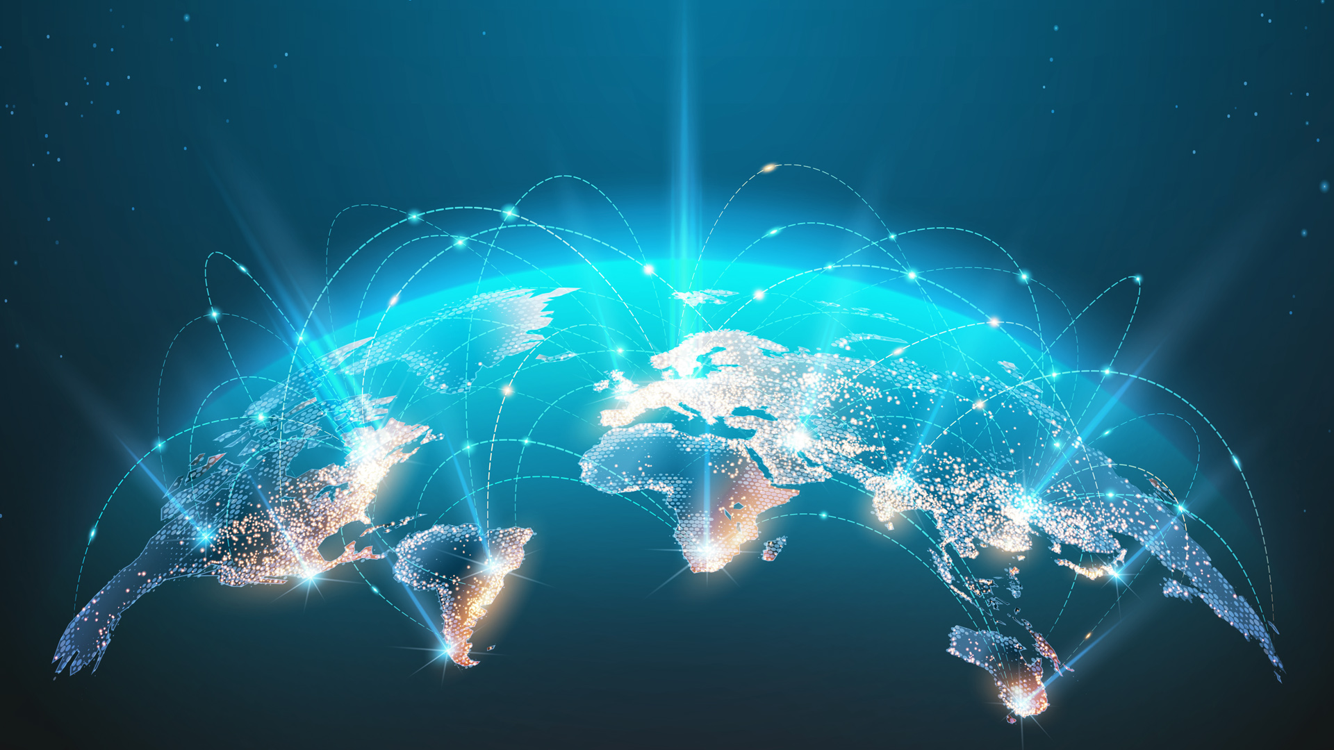 Cityscape at night, lit up by a network of lights, creating a  view of the illuminated city.